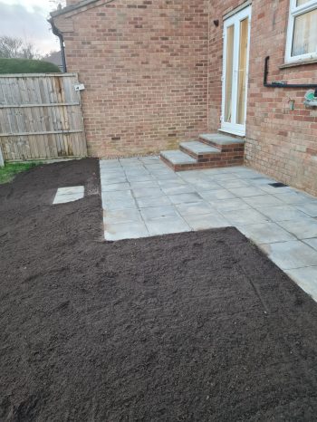 new backdoor step constructed with small patio